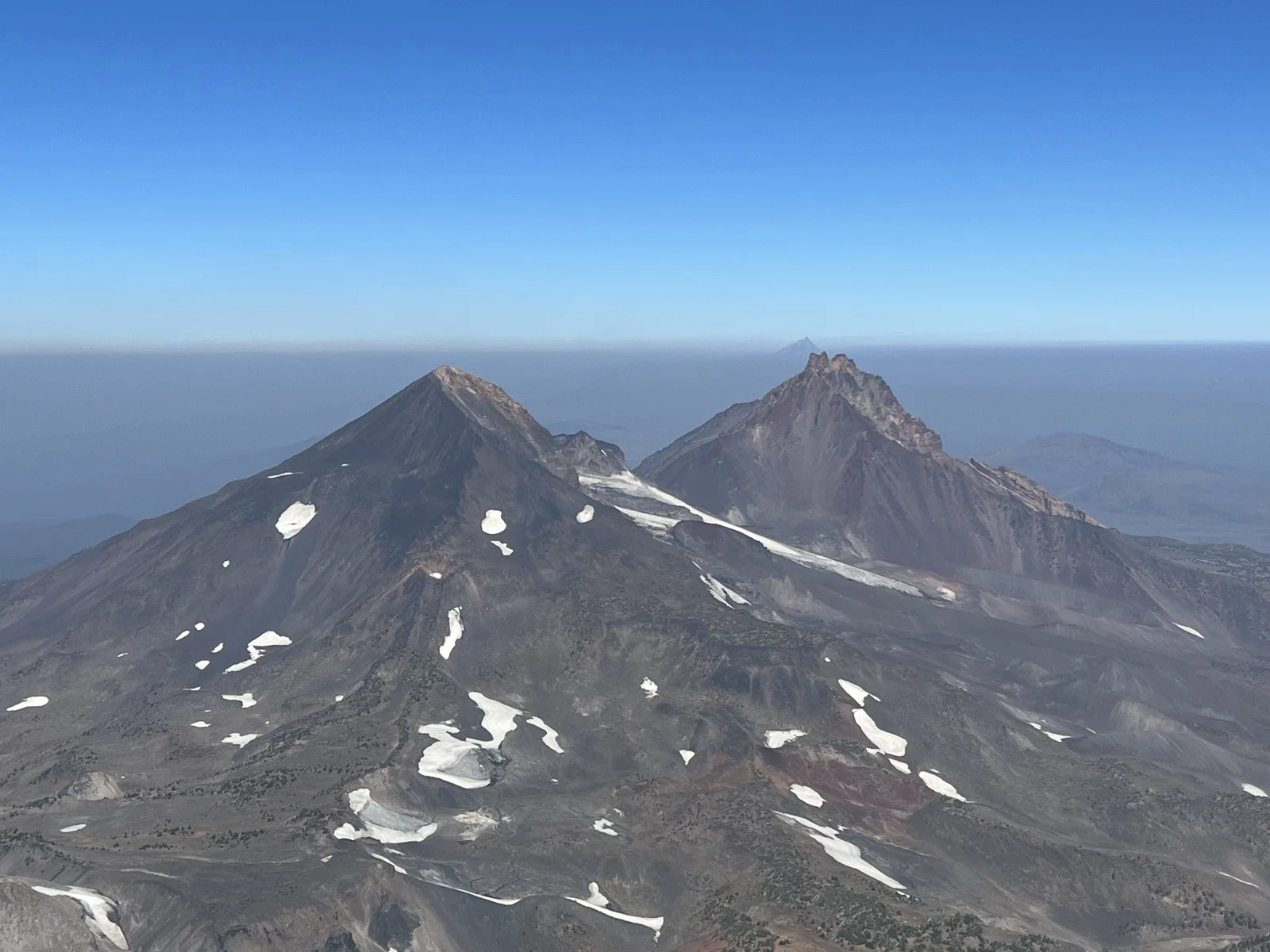 Middle Sister and North Sister viewed from the South Sister summit, Three Sisters Wilderness, Oregon